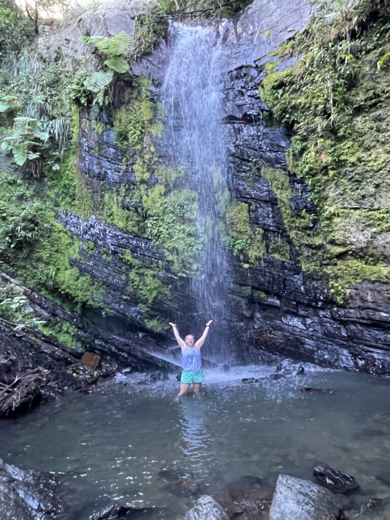 Maddy enjoys water fall at Juan Diego Creek
