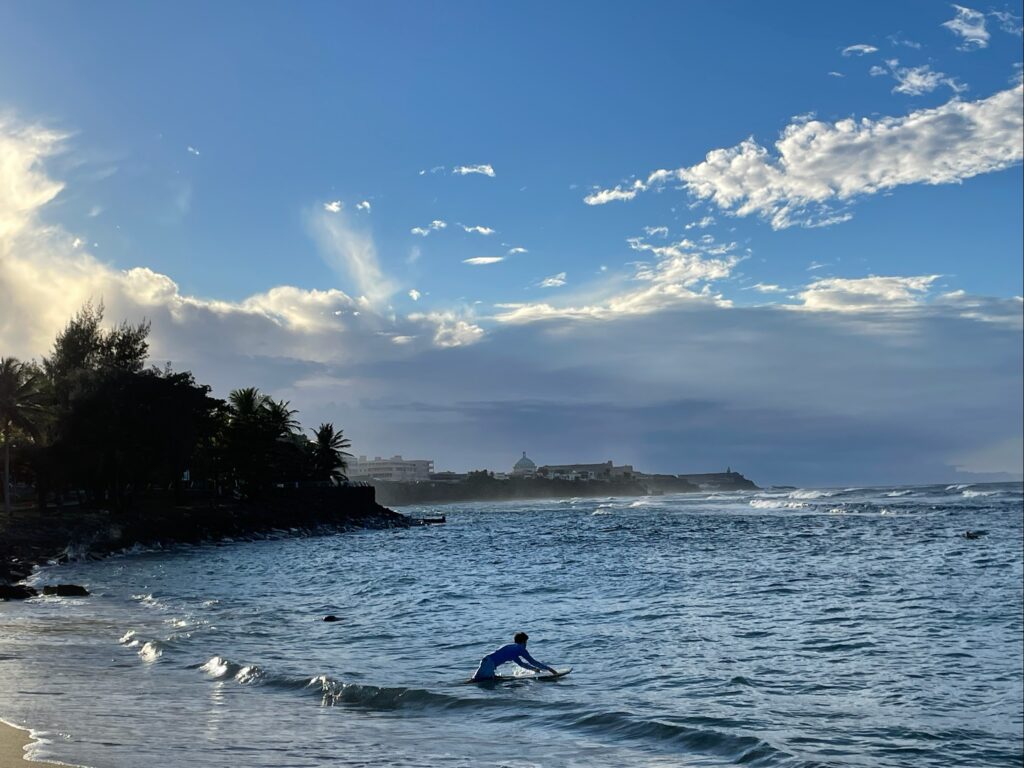 Surfer at Escambron Beach in San Juan, PR