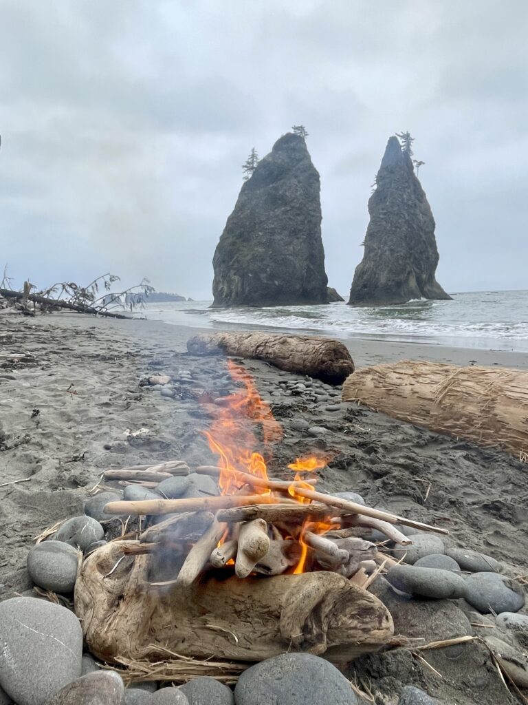 Driftwood fire with Rialto beach in background