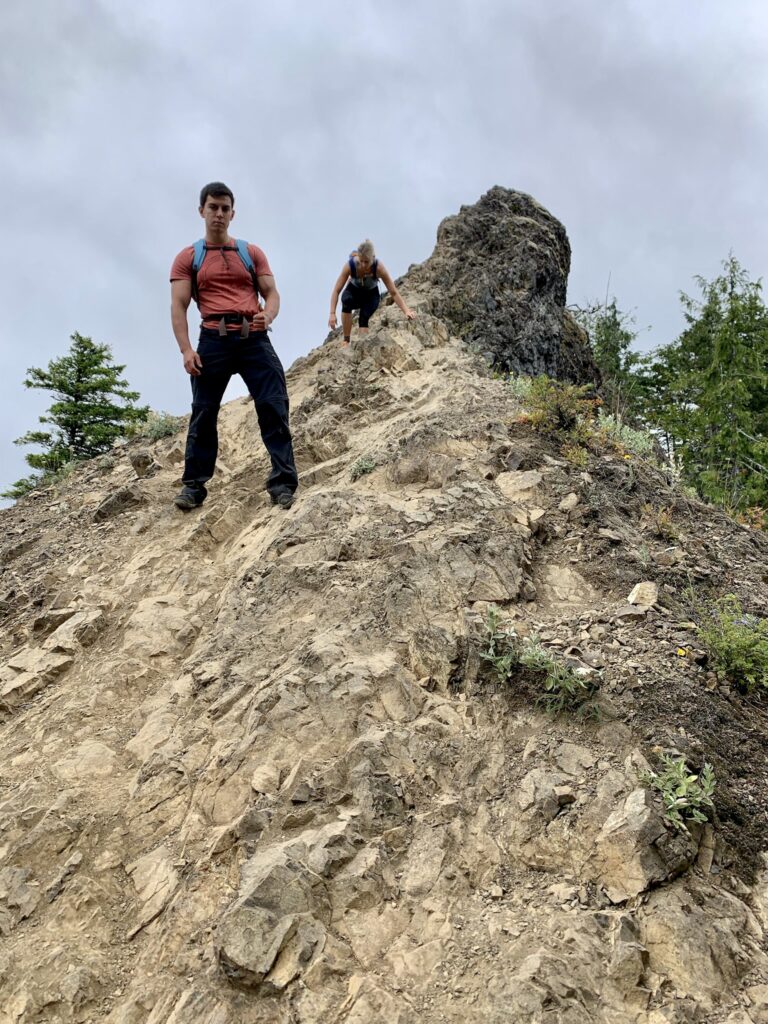 Bolder scrambling near the top of Mount Storm King