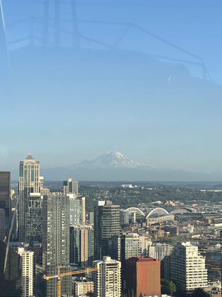 Seattle skyline with Mount Rainier in the background from observation deck at Space Needle