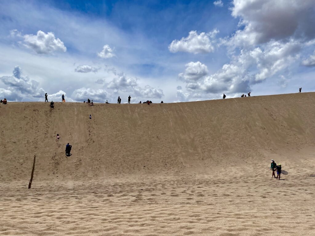 Looking up at our sandboarding dune