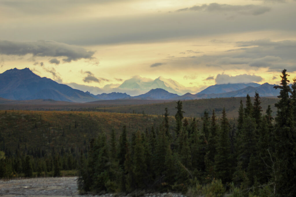Denali mountain in the distance with a glow.