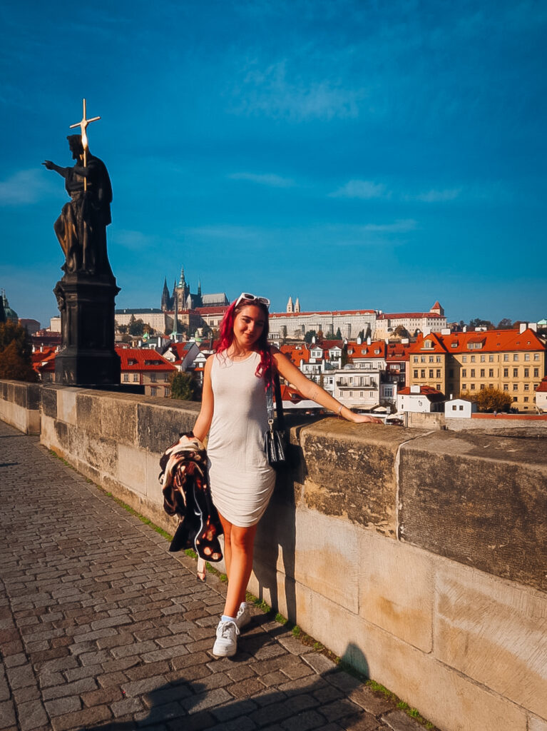 A woman on a bridge in Prague.