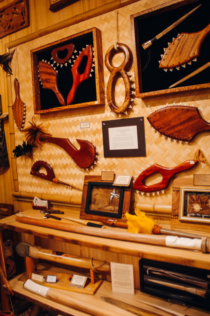 Artwork including paddles with shark teeth along the outsides.