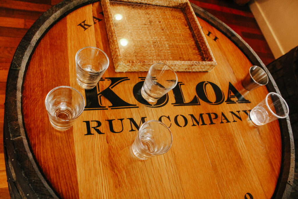 Koloa Rum Co. shot glasses on a barrel
