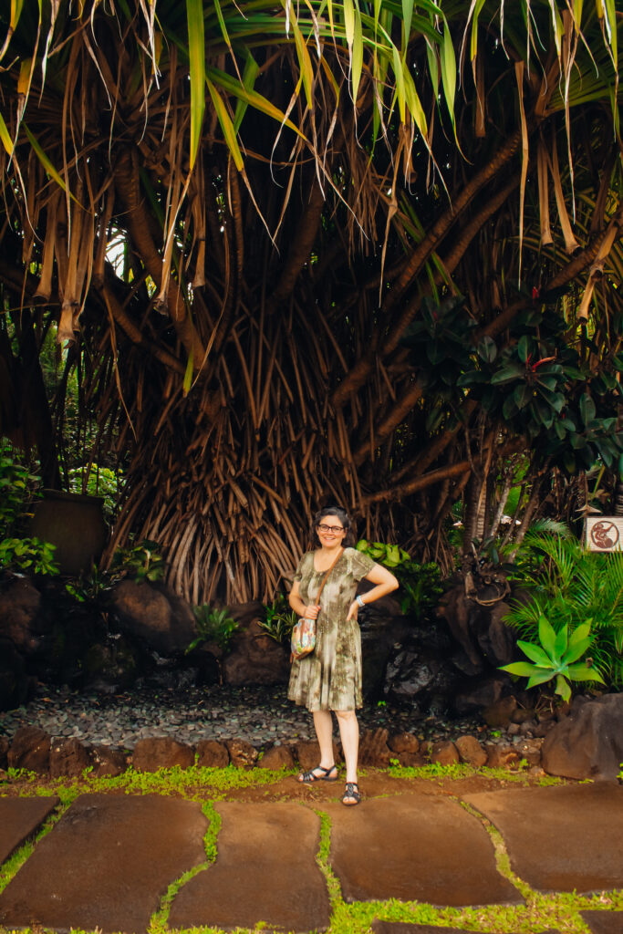 Leslie standing in front of a tree at Kilohana Plantation