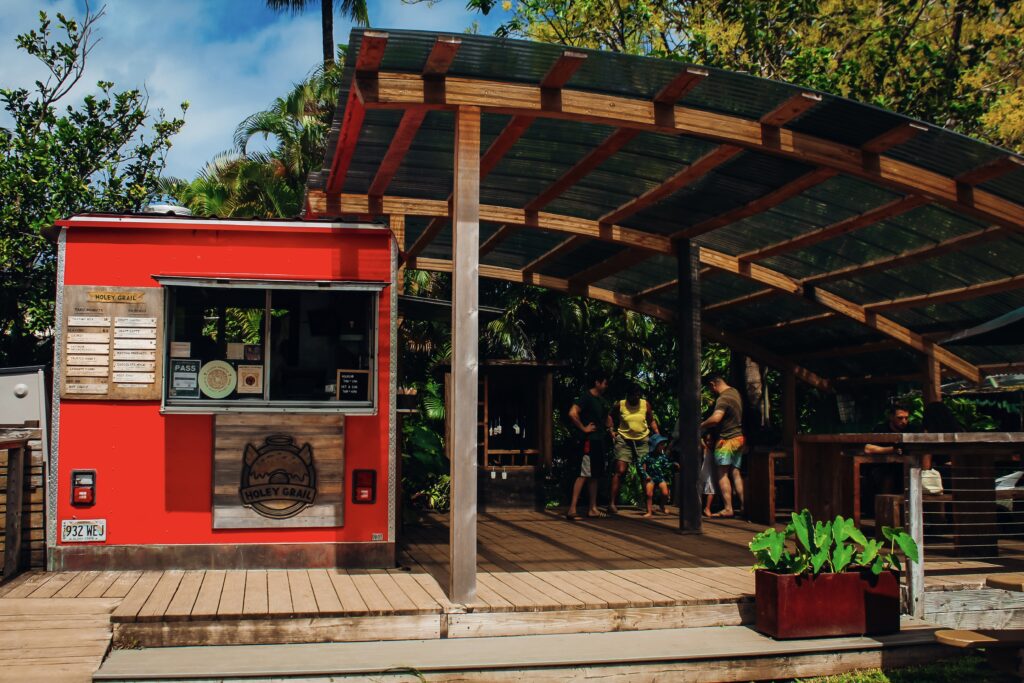 Red food hut with patio.