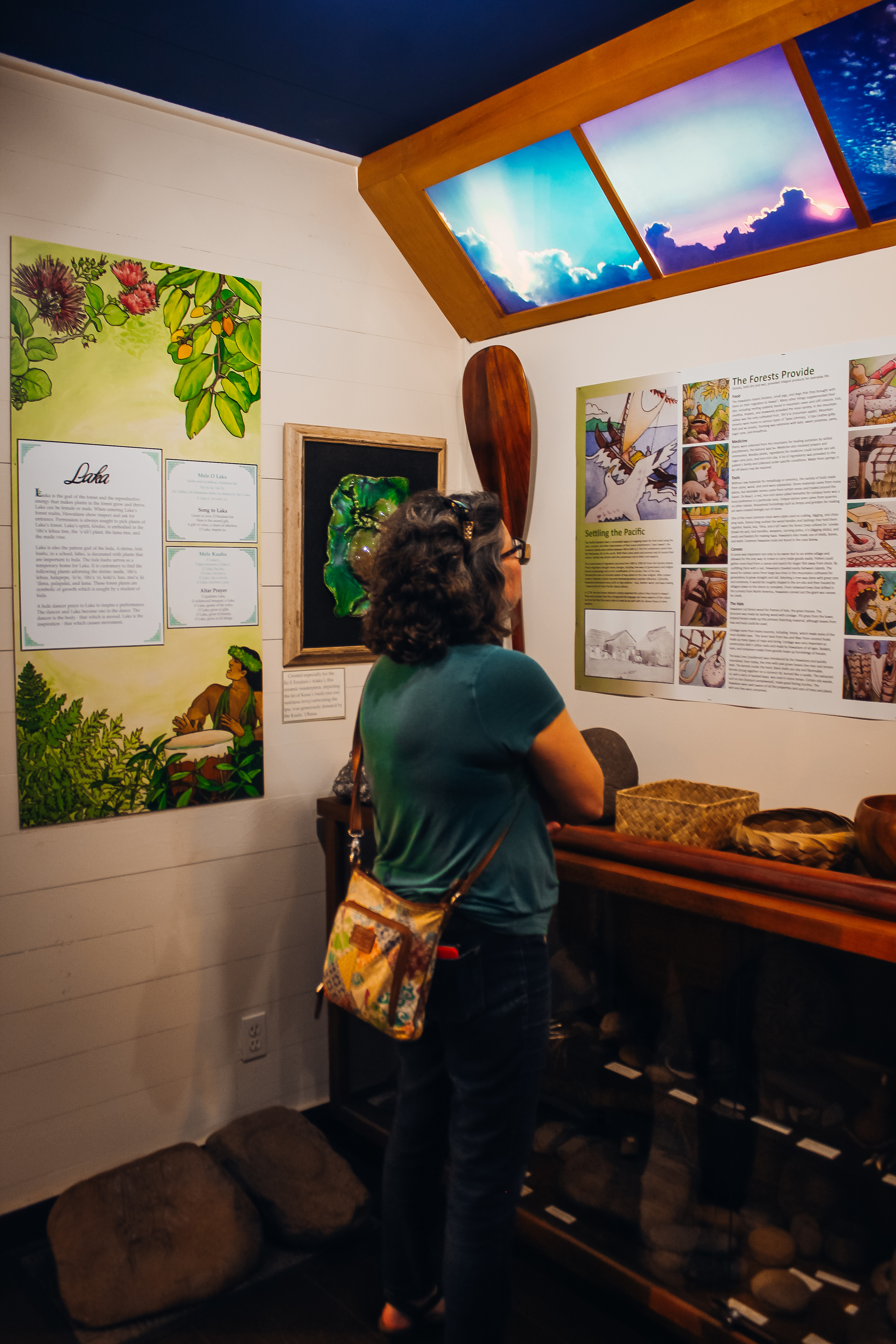 Woman reading signs in a museum