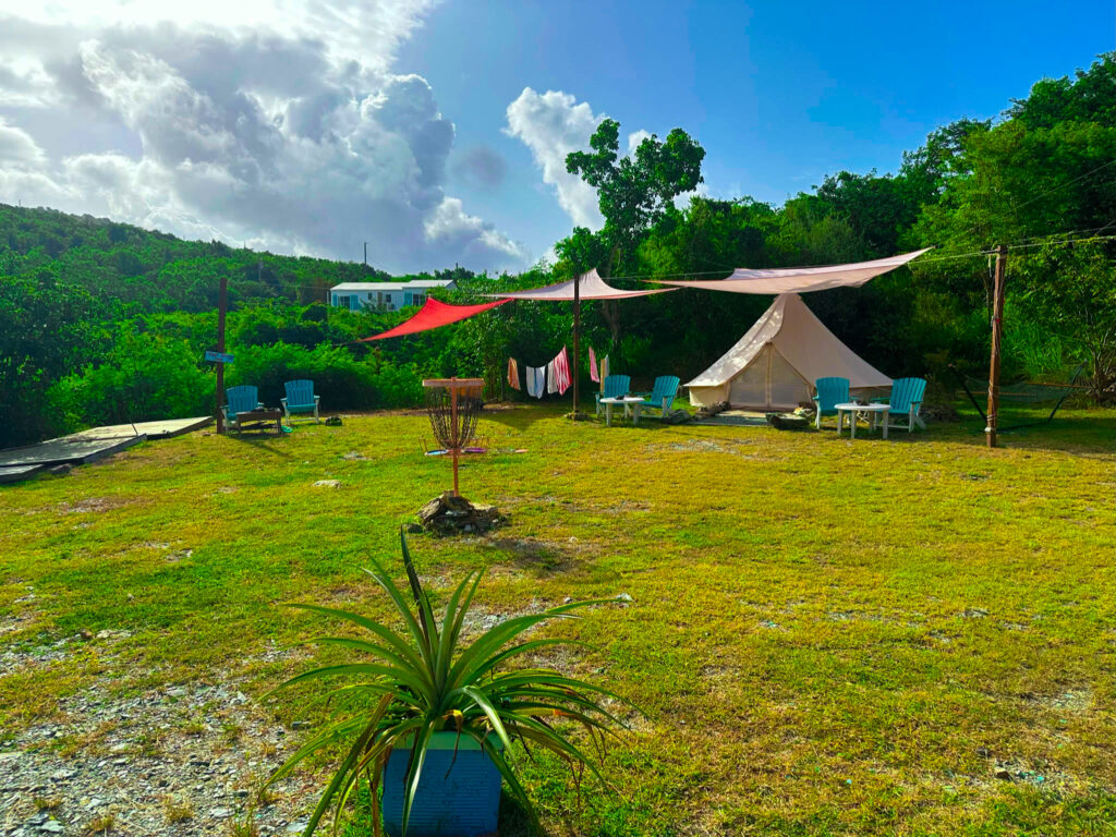 Campsites in the daylight with a canvas tent.