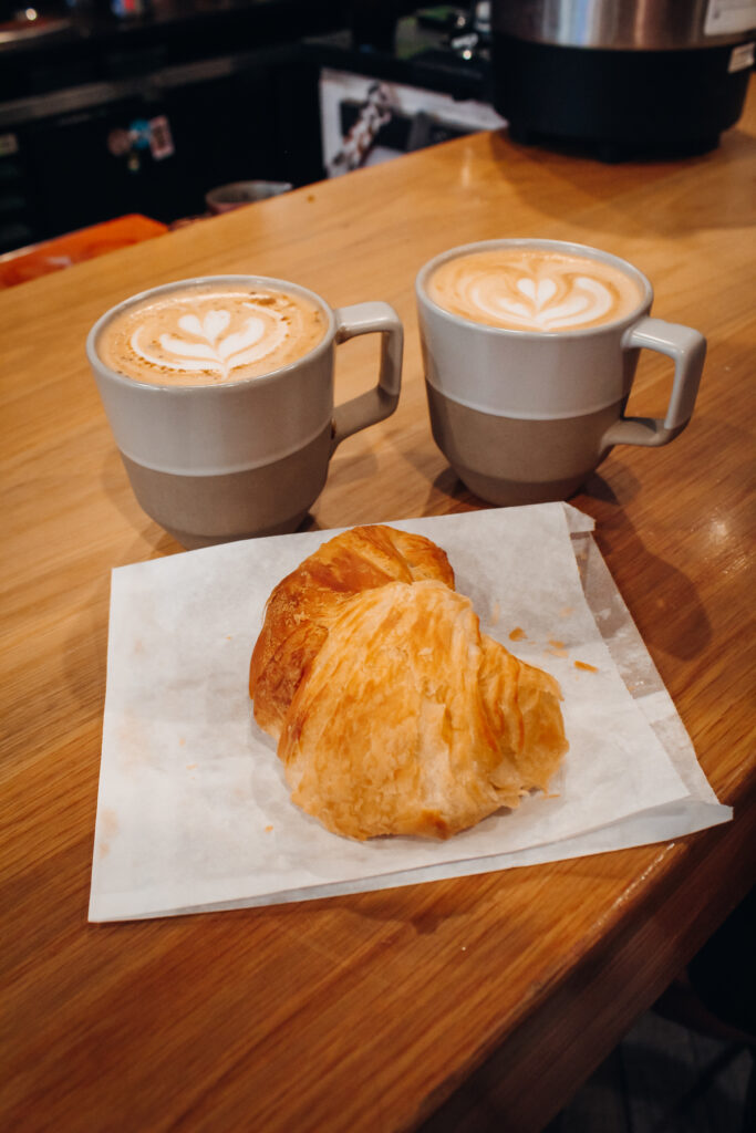 Lattes and a croissant.