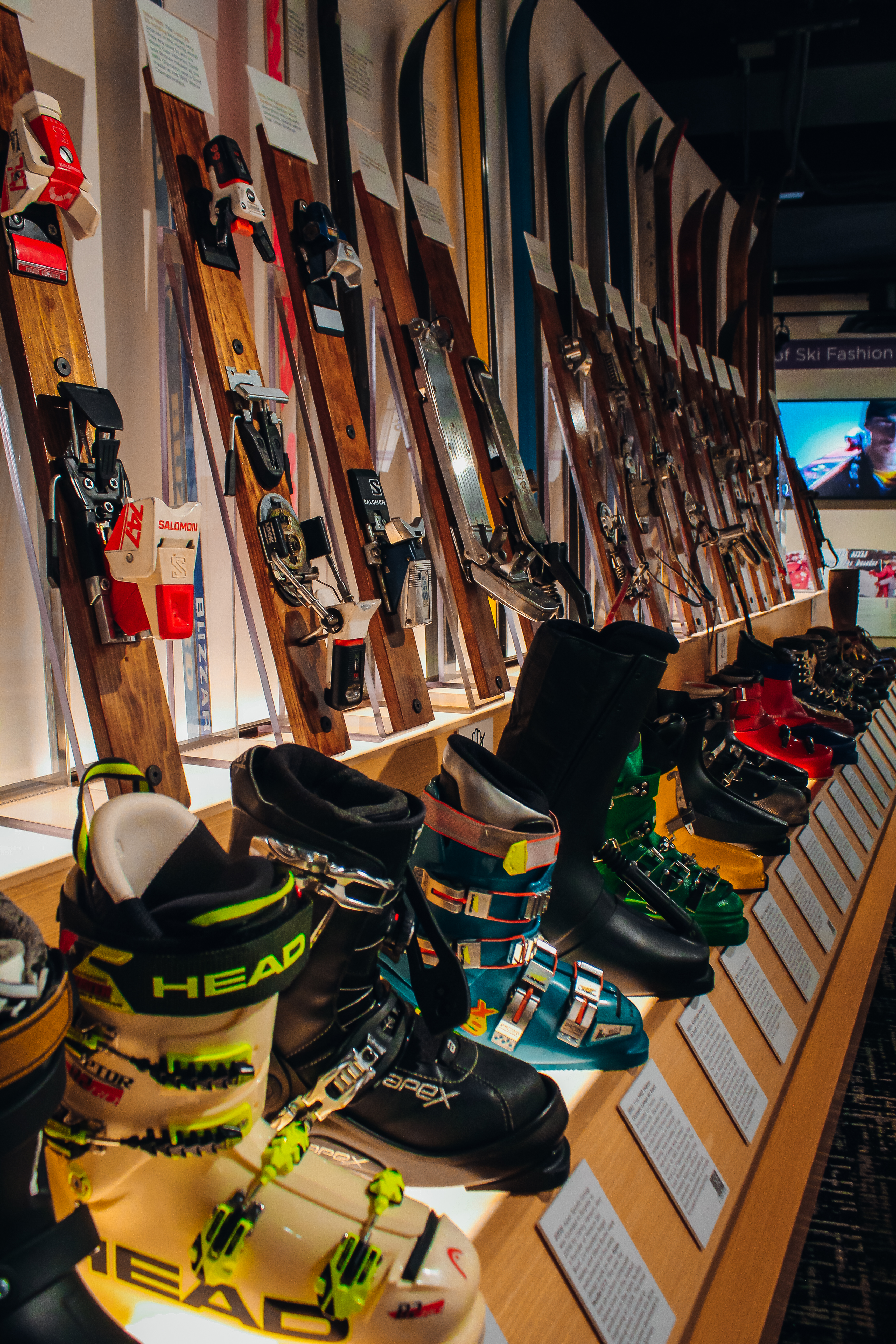 A wall of skis and snow boots.