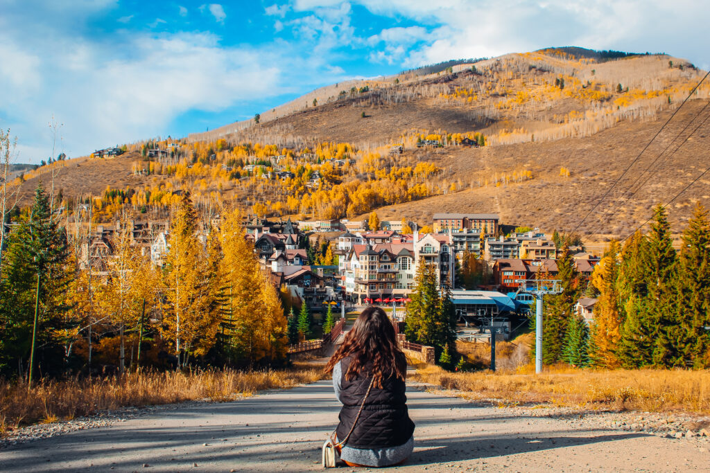 Woman looking out at a view of Vail Colorado