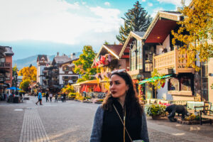 A woman standing in front of Vail.