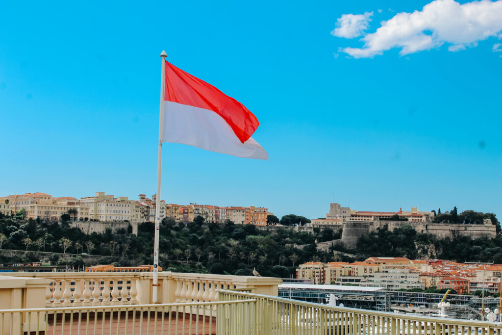 View of Monaco flag and Old Town